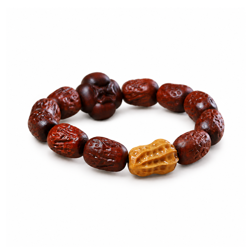 Carved red sandalwood bracelet with yellow peanut and dark persimmon accents on white