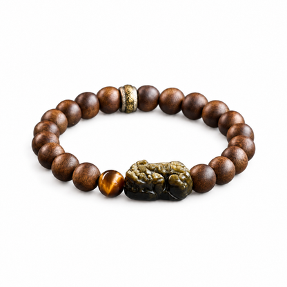 8mm agarwood bracelet with carved Pixiu centerpiece on white background