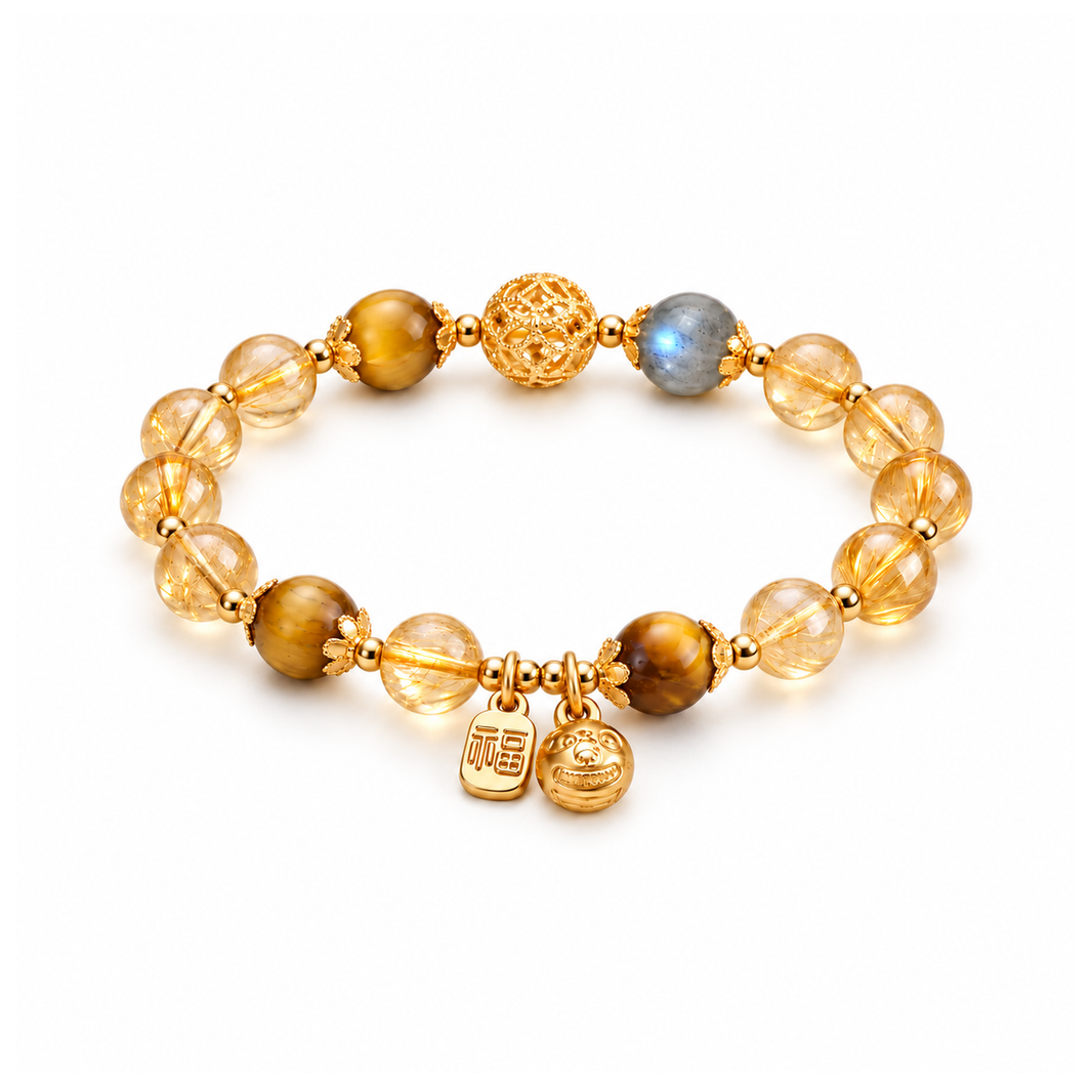 Golden rutilated quartz, tiger eye and moonstone bracelet with gold-tone blessing charms on white