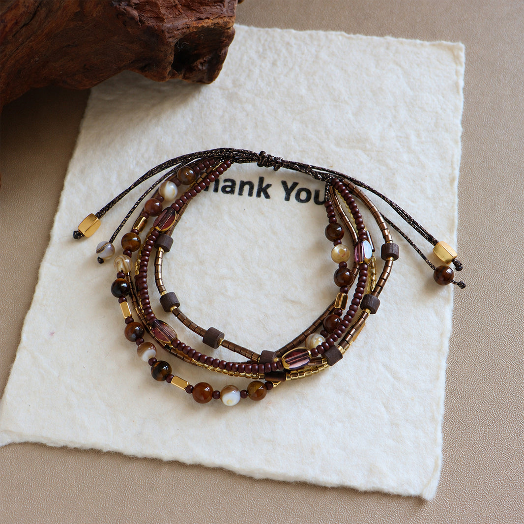 Brown and cream shell bead bracelet with sliding knot