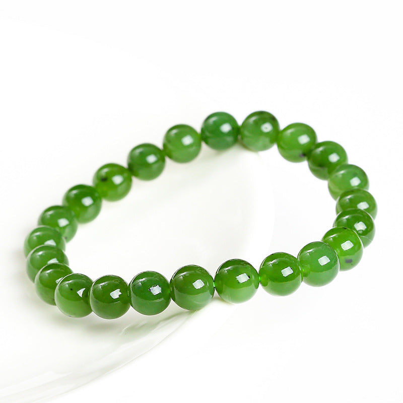 Green jade bracelet at an oblique angle