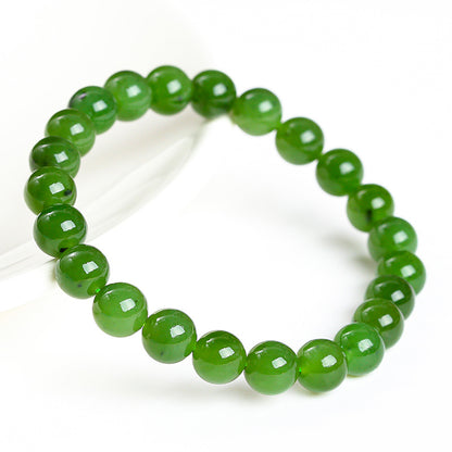 Green Hetian jade bead bracelet close angled view