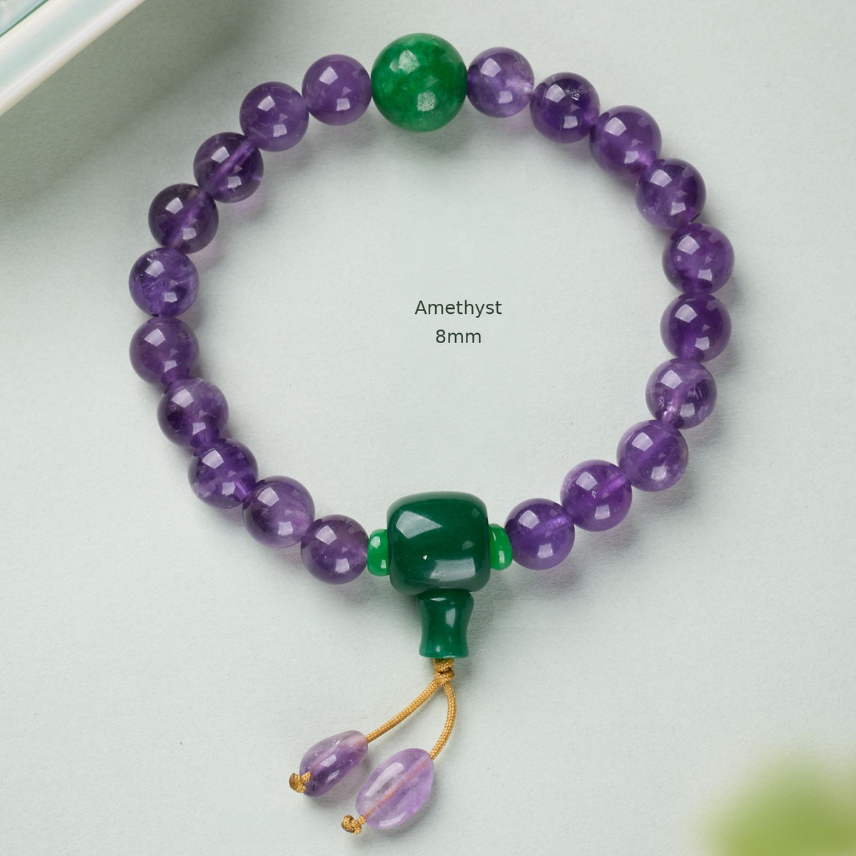 Amethyst – 8mm bracelet with green accents and cord drops