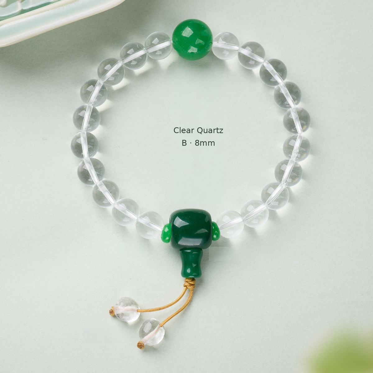 Clear Quartz B – 8mm bracelet with green accents and cord drops