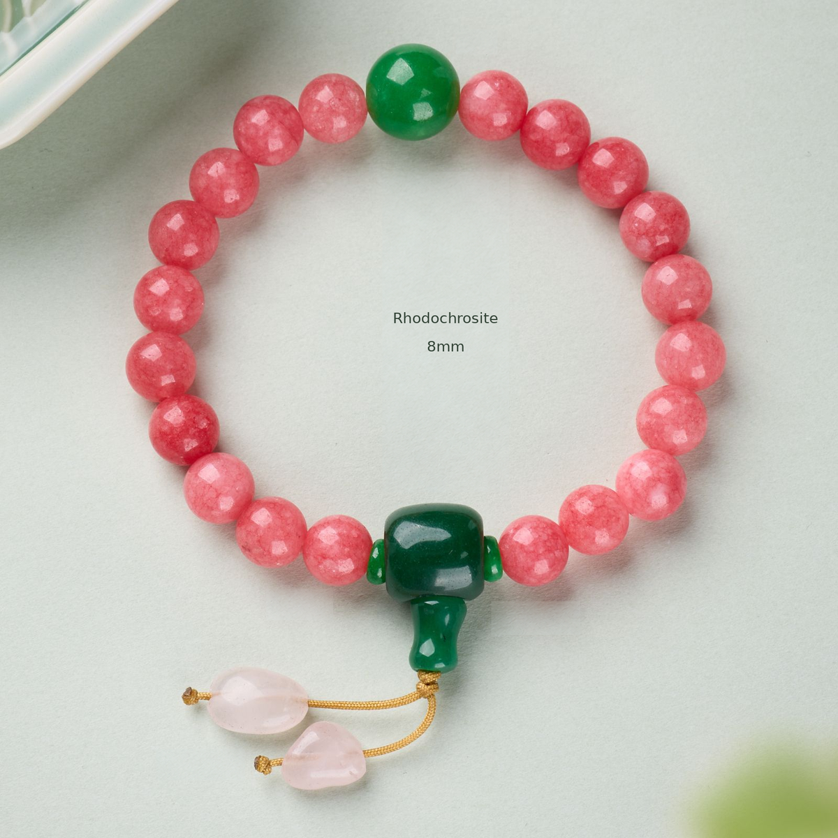 Rhodochrosite – 8mm bracelet with green accents and cord drops