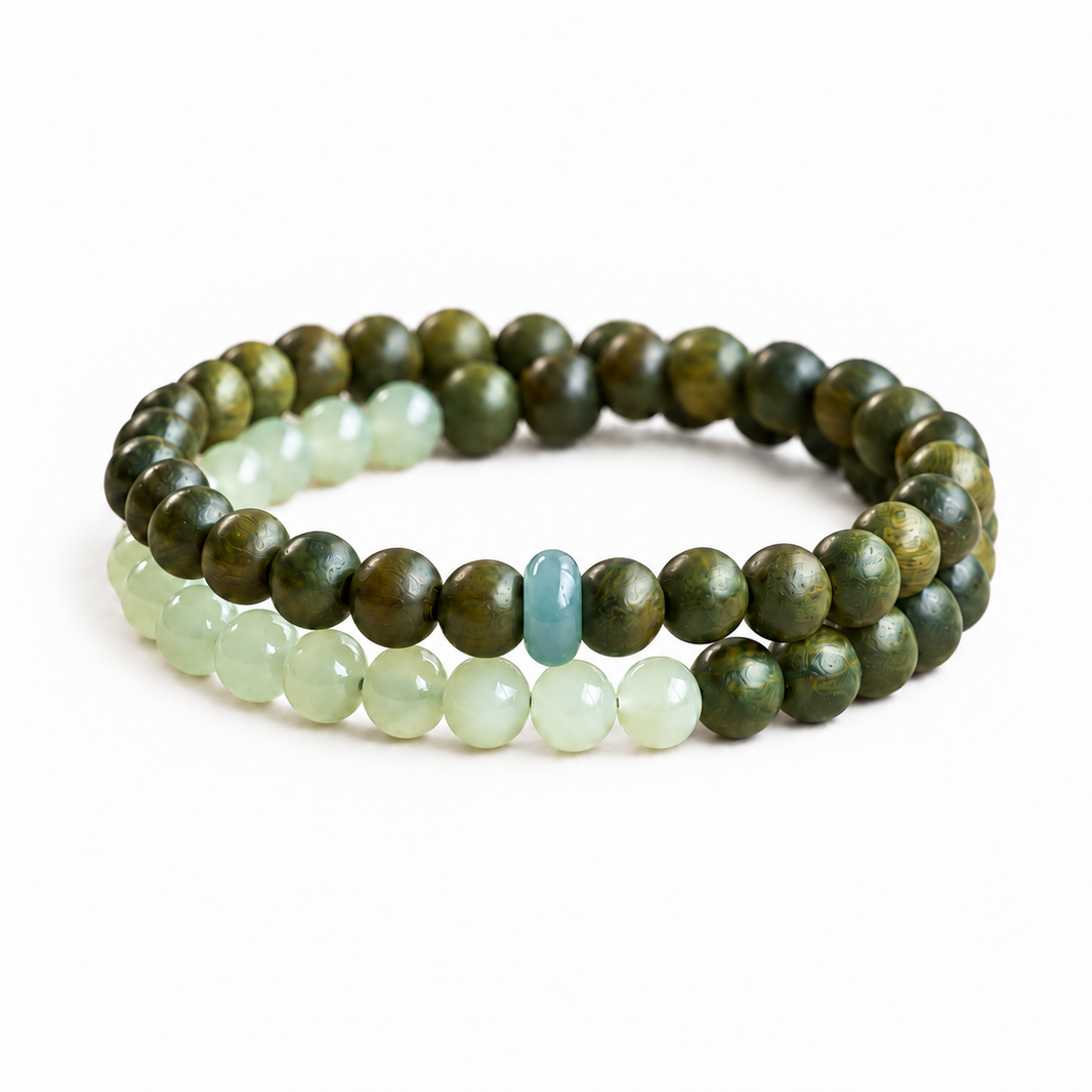 Green sandalwood and jade double-wrap bracelet on white background
