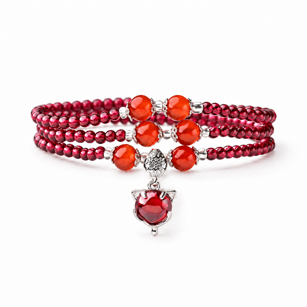 Natural garnet triple-wrap bracelet with six orange-red accents and red fox charm on white