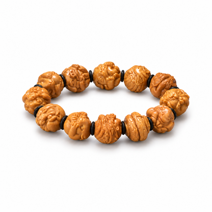 Honey-toned sandalwood zodiac bracelet with carved animal beads and black spacers on white