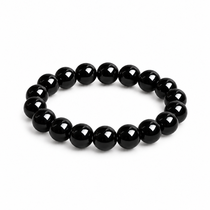 Natural black obsidian bracelet on a white background