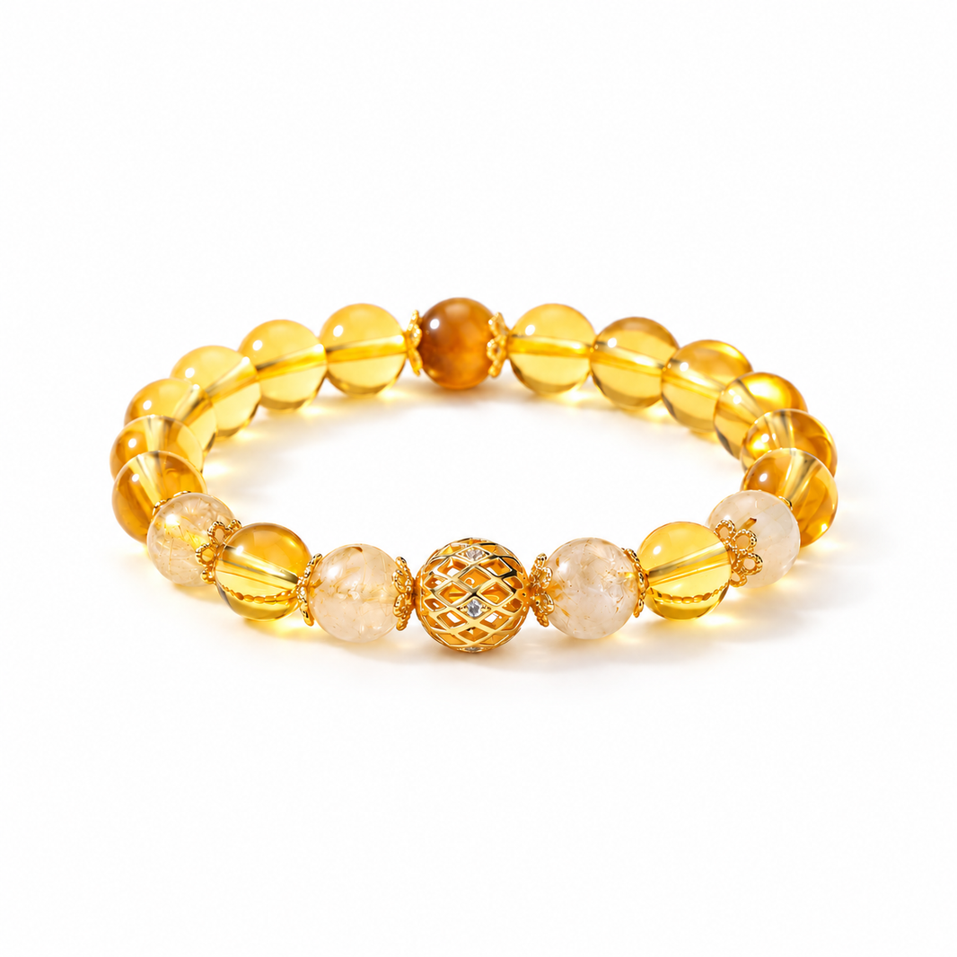 Golden rutilated quartz and citrine bracelet on white background