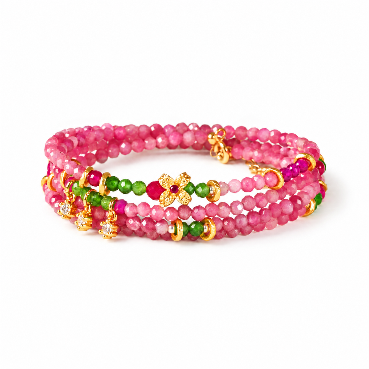 Virgo pink tourmaline zodiac wrap bracelet with green accents and gold-tone flower details on a white background